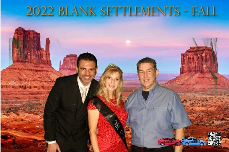 A photo of a man and woman posing in front of a desert.